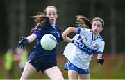 28 June 2025; Brinan O'Sullivan of New York in action against Grace McVey of Ballinderry Shamrocks during the LGFA Division 1 match between New York and Ballinderry Shamrocks at the John West Féile Peile na nÓg Gaelic Football and LGFA National Finals at Derry GAA Centre of Excellence in Owenbeg, Derry. Photo by Shauna Clinton/Sportsfile