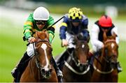 28 June 2025; Trustyourinstinct, left, with Dylan Browne McMonagle up, on their way to winning the Al Basti Equiworld International Stakes during day two of the Dubai Duty Free Irish Derby Festival at The Curragh Racecourse in Kildare. Photo by Seb Daly/Sportsfile