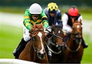 28 June 2025; Trustyourinstinct, left, with Dylan Browne McMonagle up, on their way to winning the Al Basti Equiworld International Stakes during day two of the Dubai Duty Free Irish Derby Festival at The Curragh Racecourse in Kildare. Photo by Seb Daly/Sportsfile