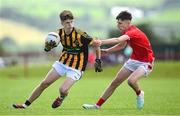 28 June 2025; Aaron Mulryan of Naomh Mearnóg in action against Teegan Heneghan of Ballytubber during the Football Division 1 match between Ballytubber and Naomh Mearnóg at the John West Féile Peile na nÓg Gaelic Football and LGFA National Finals at Derry GAA Centre of Excellence in Owenbeg, Derry. Photo by Shauna Clinton/Sportsfile