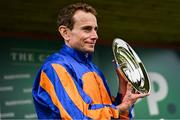 28 June 2025; Jockey Ryan Moore with the trophy after riding Whirl to victory in the Paddy Power Pretty Polly Stakes during day two of the Dubai Duty Free Irish Derby Festival at The Curragh Racecourse in Kildare. Photo by Seb Daly/Sportsfile