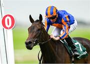 28 June 2025; Whirl, left, with Ryan Moore up, on their way to winning the Paddy Power Pretty Polly Stakes during day two of the Dubai Duty Free Irish Derby Festival at The Curragh Racecourse in Kildare. Photo by Seb Daly/Sportsfile
