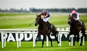 28 June 2025; Whirl, left, with Ryan Moore up, on their way to winning the Paddy Power Pretty Polly Stakes, from second place Kalpana, right, with Colin Keane up, during day two of the Dubai Duty Free Irish Derby Festival at The Curragh Racecourse in Kildare. Photo by Seb Daly/Sportsfile