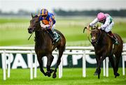 28 June 2025; Whirl, left, with Ryan Moore up, on their way to winning the Paddy Power Pretty Polly Stakes, from second place Kalpana, right, with Colin Keane up, during day two of the Dubai Duty Free Irish Derby Festival at The Curragh Racecourse in Kildare. Photo by Seb Daly/Sportsfile