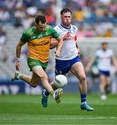28 June 2025; Caolan McColgan of Donegal in action against Andrew Woods of Monaghan during the GAA Football All-Ireland Senior Championship quarter-final match between Monaghan and Donegal at Croke Park in Dublin. Photo by Ray McManus/Sportsfile