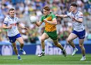 28 June 2025; Ciaran Moore of Donegal in action against Aaron Carey of Monaghan during the GAA Football All-Ireland Senior Championship quarter-final match between Monaghan and Donegal at Croke Park in Dublin. Photo by David Fitzgerald/Sportsfile