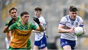 28 June 2025; Stephen O'Hanlon of Monaghan in action against Finnbarr Roarty of Donegal during the GAA Football All-Ireland Senior Championship quarter-final match between Monaghan and Donegal at Croke Park in Dublin. Photo by Piaras Ó Mídheach/Sportsfile
