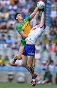 28 June 2025; Micheal McCarville of Monaghan in action against Michael Langan of Donegal during the GAA Football All-Ireland Senior Championship quarter-final match between Monaghan and Donegal at Croke Park in Dublin. Photo by David Fitzgerald/Sportsfile