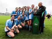 28 June 2025; Callan United players are presented with the trophy by FAI director of competitions Fran Gavin after the FAI Women's Under-17 Cup final match between Athenry FC and Callan United at Fairview Rangers AFC in Limerick. Photo by Thomas Flinkow/Sportsfile
