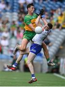 28 June 2025; Micheal McCarville of Monaghan in action against Michael Langan of Donegal during the GAA Football All-Ireland Senior Championship quarter-final match between Monaghan and Donegal at Croke Park in Dublin. Photo by David Fitzgerald/Sportsfile