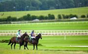 28 June 2025; Jockeys Colin Keane, left, and Ryan Moore, with their mounts Kalpana and Whirl, go to post before the Paddy Power Pretty Polly Stakes during day two of the Dubai Duty Free Irish Derby Festival at The Curragh Racecourse in Kildare. Photo by Seb Daly/Sportsfile