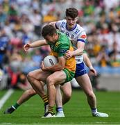 28 June 2025; Conor O'Donnell of Donegal is tackled by Aaron Carey of Monaghan during the GAA Football All-Ireland Senior Championship quarter-final match between Monaghan and Donegal at Croke Park in Dublin. Photo by Ray McManus/Sportsfile
