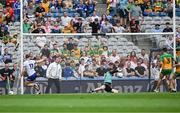 28 June 2025; Mícheál Bannigan of Monaghan shoots past Donegal goalkeeper Shaun Patton to score his side's first goal  during the GAA Football All-Ireland Senior Championship quarter-final match between Monaghan and Donegal at Croke Park in Dublin. Photo by Ray McManus/Sportsfile
