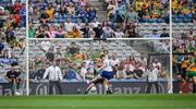 28 June 2025; Mícheál Bannigan of Monaghan shoots past Donegal goalkeeper Shaun Patton to score his side's first goal during the GAA Football All-Ireland Senior Championship quarter-final match between Monaghan and Donegal at Croke Park in Dublin. Photo by Ray McManus/Sportsfile