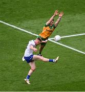 28 June 2025; Ryan McAnespie of Monaghan scores a point despite the efforts of Eoghan Bán Gallagher of Donegal during the GAA Football All-Ireland Senior Championship quarter-final match between Monaghan and Donegal at Croke Park in Dublin. Photo by Daire Brennan/Sportsfile