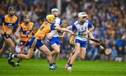 28 June 2025; Dylan Murphy of Waterford is tackled by Zak Phelan of Clare during the Electric Ireland GAA Hurling All-Ireland Minor Championship final match between Waterford and Clare at FBD Semple Stadium in Thurles, Tipperary. Photo by Brendan Moran/Sportsfile