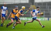 28 June 2025; Jamie Shanahan of Waterford in action against Colm Daly and Zak Phelan of Clare during the Electric Ireland GAA Hurling All-Ireland Minor Championship final match between Waterford and Clare at FBD Semple Stadium in Thurles, Tipperary. Photo by Brendan Moran/Sportsfile