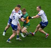 28 June 2025; Ciarán Moore of Donegal in action against Monaghan players, left to right, Ryan O'Toole, Darren Hughes, and Jack McCarron during the GAA Football All-Ireland Senior Championship quarter-final match between Monaghan and Donegal at Croke Park in Dublin. Photo by Daire Brennan/Sportsfile