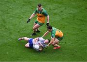 28 June 2025; Dylan Byrne of Monaghan in action against Finnbarr Roarty of Donegal during the GAA Football All-Ireland Senior Championship quarter-final match between Monaghan and Donegal at Croke Park in Dublin. Photo by Daire Brennan/Sportsfile