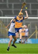 28 June 2025; Ian O'Brien of Clare in action against Bradley Penkert of Waterford during the Electric Ireland GAA Hurling All-Ireland Minor Championship final match between Waterford and Clare at FBD Semple Stadium in Thurles, Tipperary. Photo by Brendan Moran/Sportsfile