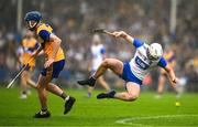 28 June 2025; Bradley Penkert of Waterford is tackled by Colm Daly of Clare during the Electric Ireland GAA Hurling All-Ireland Minor Championship final match between Waterford and Clare at FBD Semple Stadium in Thurles, Tipperary. Photo by Brendan Moran/Sportsfile