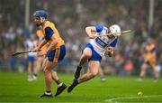 28 June 2025; Bradley Penkert of Waterford is tackled by Colm Daly of Clare during the Electric Ireland GAA Hurling All-Ireland Minor Championship final match between Waterford and Clare at FBD Semple Stadium in Thurles, Tipperary. Photo by Brendan Moran/Sportsfile