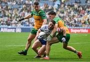 28 June 2025; Dylan Byrne of Monaghan in action against Finnbarr Roarty of Donegal during the GAA Football All-Ireland Senior Championship quarter-final match between Monaghan and Donegal at Croke Park in Dublin. Photo by David Fitzgerald/Sportsfile