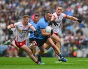 28 June 2025; Ciarán Kilkenny of Dublin in action against Peter Harte, left, and Conn Kilpatrick of Tyrone during the GAA Football All-Ireland Senior Championship quarter-final match between Dublin and Tyrone at Croke Park in Dublin. Photo by Ray McManus/Sportsfile