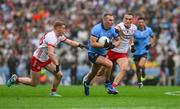 28 June 2025; Ciarán Kilkenny of Dublin in action against Peter Harte, left, and Conn Kilpatrick of Tyrone during the GAA Football All-Ireland Senior Championship quarter-final match between Dublin and Tyrone at Croke Park in Dublin. Photo by Ray McManus/Sportsfile