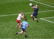 28 June 2025; Dublin goalkeeper Stephen Cluxton gets to the ball ahead of Cormac Quinn of Tyrone during the GAA Football All-Ireland Senior Championship quarter-final match between Dublin and Tyrone at Croke Park in Dublin. Photo by Daire Brennan/Sportsfile