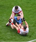 28 June 2025; Lee Gannon of Dublin in action against Rory Brennan, left, and Kieran McGeary of Tyrone during the GAA Football All-Ireland Senior Championship quarter-final match between Dublin and Tyrone at Croke Park in Dublin. Photo by Daire Brennan/Sportsfile