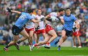 28 June 2025; Brian Kennedy of Tyrone action against Brian O'Leary of Dublin, left, and Killian McGinnis during the GAA Football All-Ireland Senior Championship quarter-final match between Dublin and Tyrone at Croke Park in Dublin. Photo by Ray McManus/Sportsfile