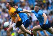 28 June 2025; Tyrone goalkeeper Niall Morgan prepares to clear under pressure from Ross McGarry and Paddy Small of Dublin, right, during the GAA Football All-Ireland Senior Championship quarter-final match between Dublin and Tyrone at Croke Park in Dublin. Photo by Ray McManus/Sportsfile