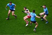 28 June 2025; Conn Kilpatrick of Tyrone in action against Dublin players, left to right, Brian Howard, Niall Scully, and Paddy Small, during the GAA Football All-Ireland Senior Championship quarter-final match between Dublin and Tyrone at Croke Park in Dublin. Photo by Daire Brennan/Sportsfile
