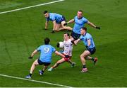 28 June 2025; Darragh Canavan of Tyrone in action against Killian McGinnis, left, and David Byrne of Dublin during the GAA Football All-Ireland Senior Championship quarter-final match between Dublin and Tyrone at Croke Park in Dublin. Photo by Daire Brennan/Sportsfile