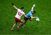 28 June 2025; Brian Howard of Dublin in action against Ciarán Daly of Tyrone during the GAA Football All-Ireland Senior Championship quarter-final match between Dublin and Tyrone at Croke Park in Dublin. Photo by Daire Brennan/Sportsfile