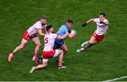 28 June 2025; Brian Howard of Dublin in action against Tyrone players, left to right, Mattie Donnelly, Peter Teague, and Darragh Canavan, during the GAA Football All-Ireland Senior Championship quarter-final match between Dublin and Tyrone at Croke Park in Dublin. Photo by Daire Brennan/Sportsfile
