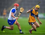 28 June 2025; Darragh Keane of Waterford  in action against Liam Murphy of Clare during the Electric Ireland GAA Hurling All-Ireland Minor Championship final match between Waterford and Clare at FBD Semple Stadium in Thurles, Tipperary. Photo by John Sheridan/Sportsfile