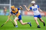 28 June 2025; Ian O’Brien of Clare in action against Bradley Penkert of Waterford during the Electric Ireland GAA Hurling All-Ireland Minor Championship final match between Waterford and Clare at FBD Semple Stadium in Thurles, Tipperary. Photo by John Sheridan/Sportsfile