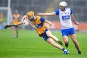 28 June 2025; Ian O’Brien of Clare in action against Bradley Penkert of Waterford during the Electric Ireland GAA Hurling All-Ireland Minor Championship final match between Waterford and Clare at FBD Semple Stadium in Thurles, Tipperary. Photo by John Sheridan/Sportsfile