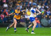28 June 2025;Tommy Kennedy of Waterford in action against James O’Donnell of Clare during the Electric Ireland GAA Hurling All-Ireland Minor Championship final match between Waterford and Clare at FBD Semple Stadium in Thurles, Tipperary. Photo by John Sheridan/Sportsfile