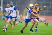 28 June 2025; Ian O’Brien of Clare in action against Bradley Penkert of Waterford during the Electric Ireland GAA Hurling All-Ireland Minor Championship final match between Waterford and Clare at FBD Semple Stadium in Thurles, Tipperary. Photo by John Sheridan/Sportsfile