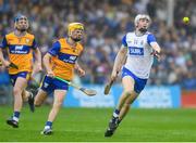 28 June 2025; Jack Power of Waterford in action against Zak Phelan of Clare during the Electric Ireland GAA Hurling All-Ireland Minor Championship final match between Waterford and Clare at FBD Semple Stadium in Thurles, Tipperary. Photo by John Sheridan/Sportsfile