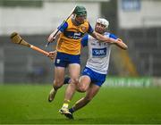 28 June 2025; Gavin Marshall of Clare in action against Bradley Penkert of Waterford during the Electric Ireland GAA Hurling All-Ireland Minor Championship final match between Waterford and Clare at FBD Semple Stadium in Thurles, Tipperary. Photo by Brendan Moran/Sportsfile