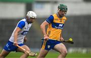 28 June 2025; Gavin Marshall of Clare in action against Bradley Penkert of Waterford during the Electric Ireland GAA Hurling All-Ireland Minor Championship final match between Waterford and Clare at FBD Semple Stadium in Thurles, Tipperary. Photo by Brendan Moran/Sportsfile