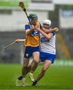 28 June 2025; Gavin Marshall of Clare in action against Bradley Penkert of Waterford during the Electric Ireland GAA Hurling All-Ireland Minor Championship final match between Waterford and Clare at FBD Semple Stadium in Thurles, Tipperary. Photo by Brendan Moran/Sportsfile
