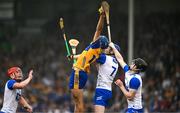 28 June 2025; Paul Rodgers of Clare attempts to catch the sliotar ahead of Tommy Kennedy of Waterford during the Electric Ireland GAA Hurling All-Ireland Minor Championship final match between Waterford and Clare at FBD Semple Stadium in Thurles, Tipperary. Photo by Brendan Moran/Sportsfile