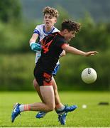 28 June 2025; Daithi Holleran of Lavey in action against Pauric McGuckin of Ballinderry during the Football Division 1 Shield Final match between Lavey and Ballinderry at the John West Féile Peile na nÓg Gaelic Football and LGFA National Finals at Derry GAA Centre of Excellence in Owenbeg, Derry. Photo by Shauna Clinton/Sportsfile