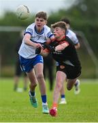 28 June 2025; Conan Boyle of Lavey in action against Fiachra Conlon of Ballinderry during the Football Division 1 Shield Final match between Lavey and Ballinderry at the John West Féile Peile na nÓg Gaelic Football and LGFA National Finals at Derry GAA Centre of Excellence in Owenbeg, Derry. Photo by Shauna Clinton/Sportsfile