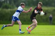 28 June 2025; Daithi Scullion of Lavey in action against Fiachra Conlon of Ballinderry during the Football Division 1 Shield Final match between Lavey and Ballinderry at the John West Féile Peile na nÓg Gaelic Football and LGFA National Finals at Derry GAA Centre of Excellence in Owenbeg, Derry. Photo by Shauna Clinton/Sportsfile